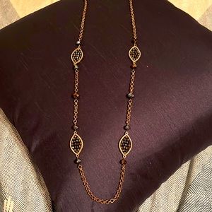 Long gold and navy necklace